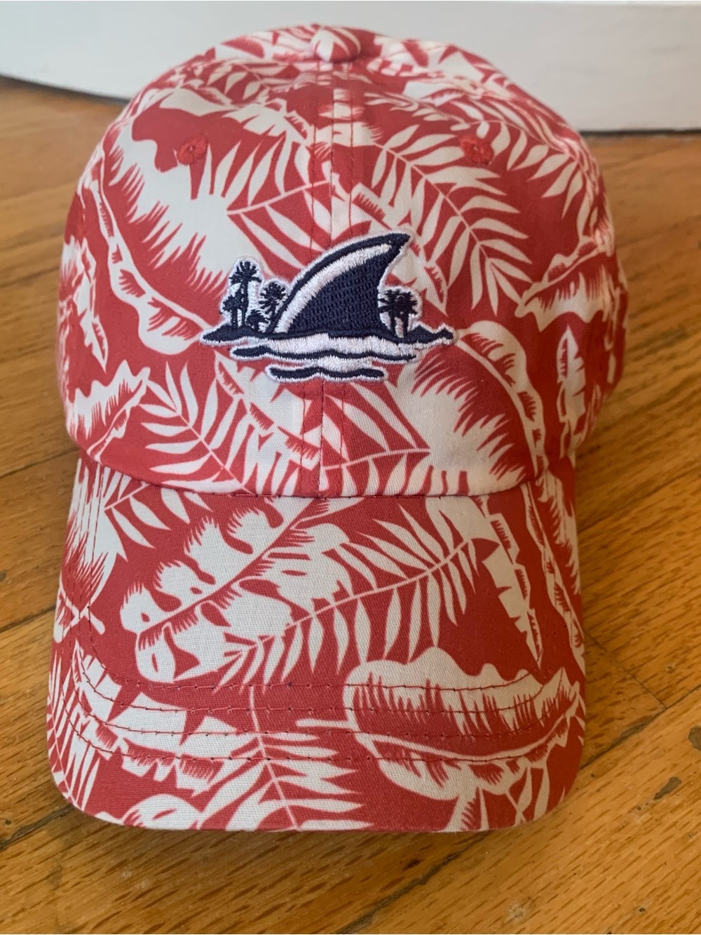 Margaritaville red/white tropical leaf print cap with shark fin and palm trees